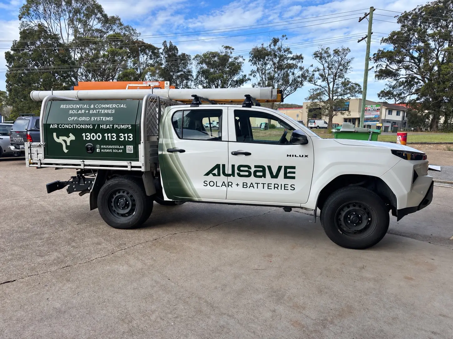 Ausave branded Toyota HiLux ute with vehicle graphics and a canopy sign