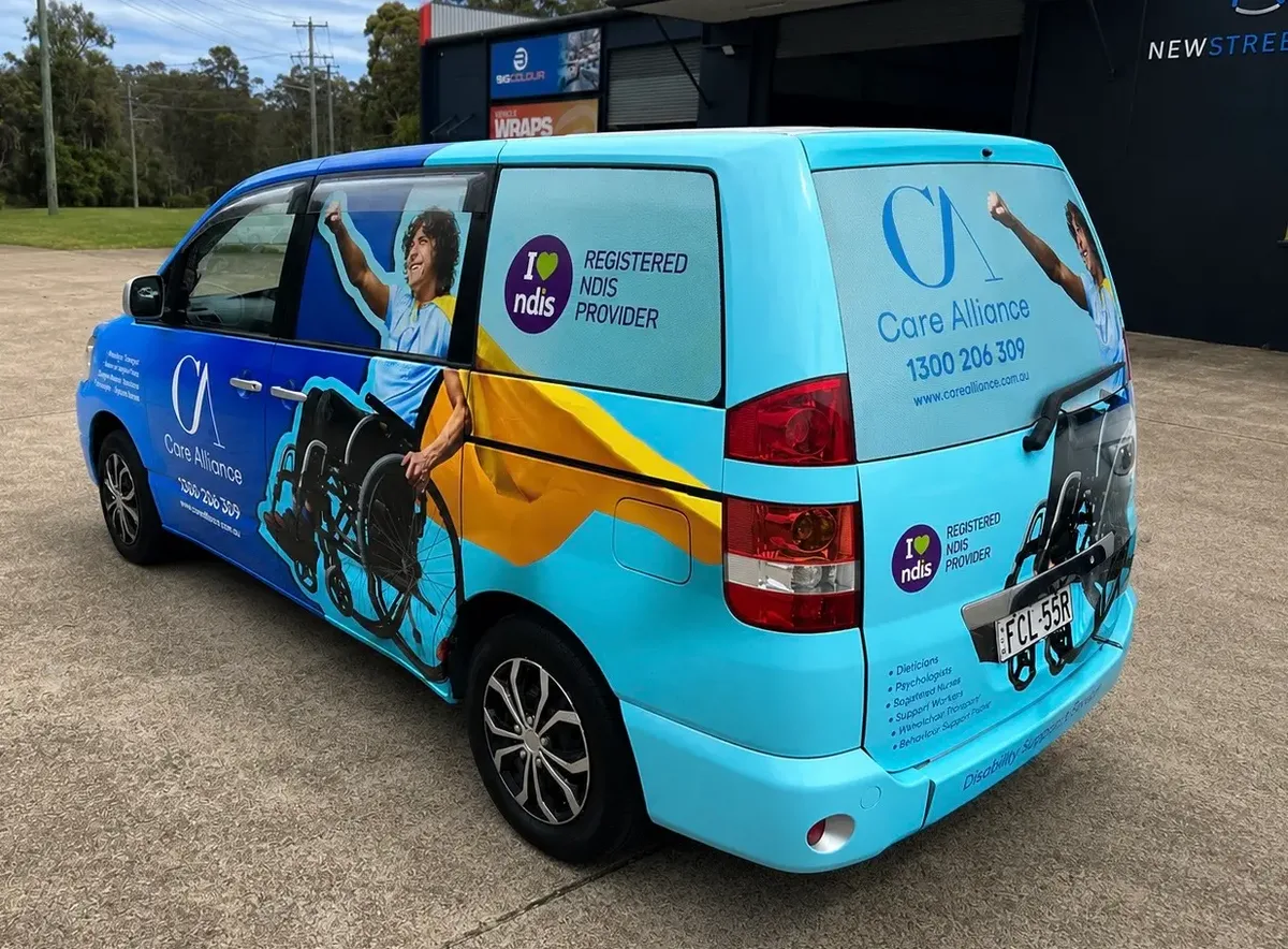Care Alliance NDIS van wrapped by Big Colour, rear view with the wheelchair graphic and service list