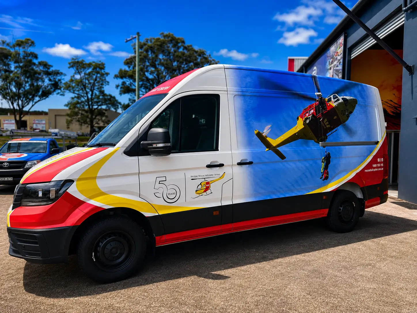 Westpac Rescue Helicopter Service van wrapped by Big Colour, left side in the red, yellow and blue rescue livery with the helicopter graphic