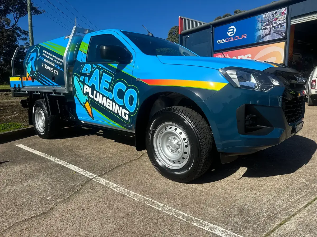 RAE.CO Plumbing tray ute wrapped by Big Colour in blue, black and neon green