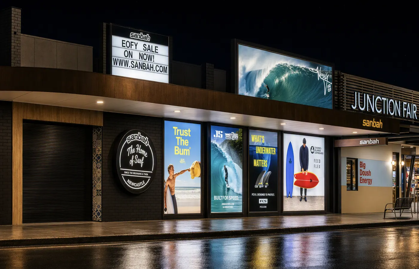 Sanbah surf shop illuminated shopfront at The Junction at night