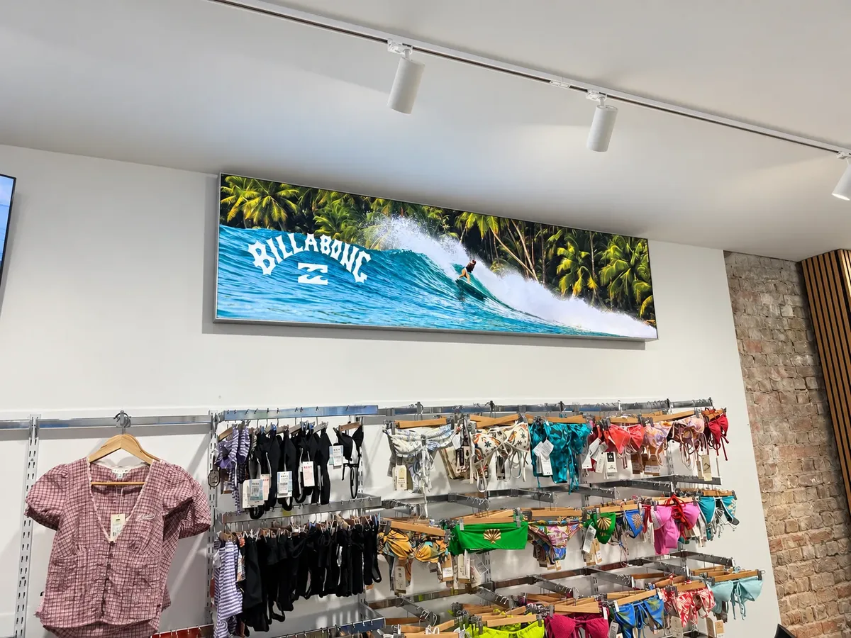 Breakaway Surf shop interior with the Billabong surf wave graphic above the swimwear display