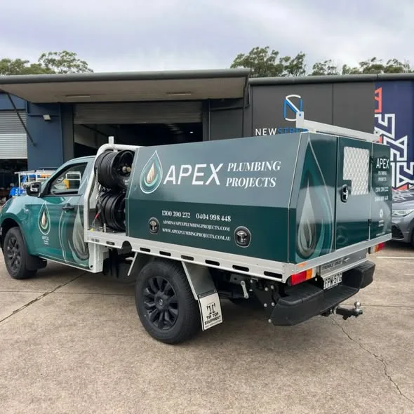 Rear three-quarter of the Apex Plumbing Projects ute, canopy back panel and hose reels on the tray