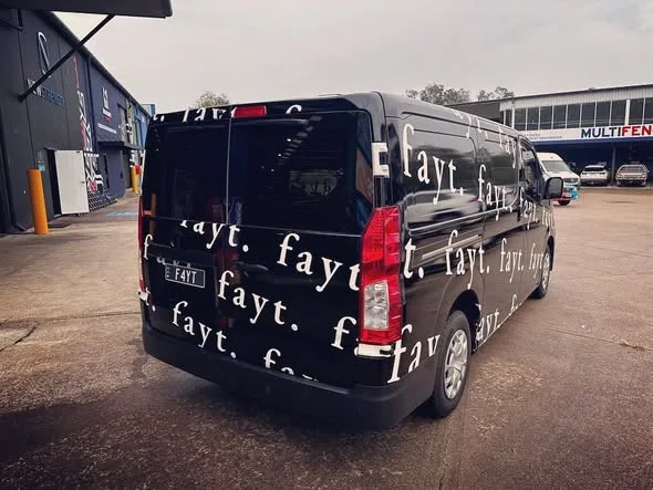 The finished black FAYT The Label van outside the workshop