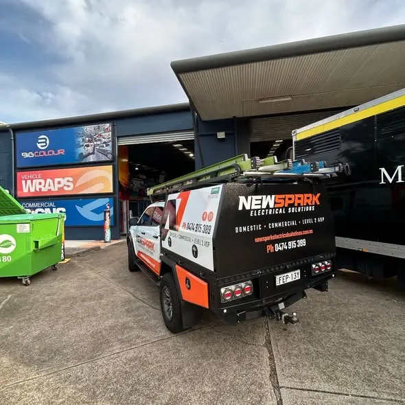 Rear of the NewSpark ute at the Big Colour workshop, website and phone across the canopy back