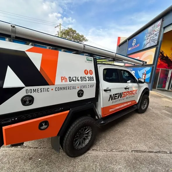 Close side view of the NewSpark canopy, the large N arrow logo and DOMESTIC COMMERCIAL LEVEL 2 ASP line