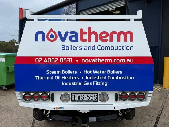 Novatherm tray-back tailgate panel listing their boiler and combustion services