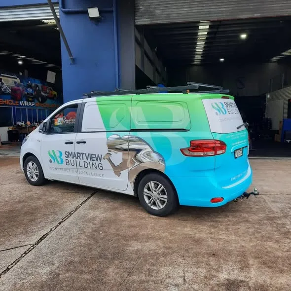 Smartview Building van side profile at the Big Colour workshop, the bright gradient running the length of the body