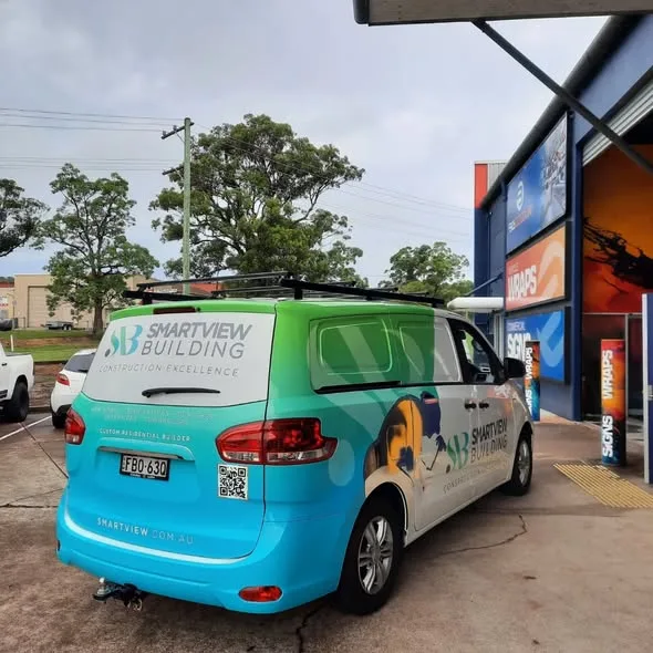 Rear quarter of the Smartview Building van showing the people feature graphic and smartview.com.au on the tailgate