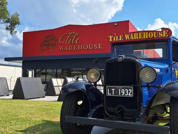 Tile Warehouse showroom fascia behind their vintage 1932 truck