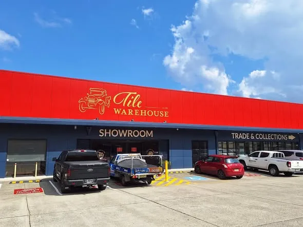Tile Warehouse showroom exterior with fascia and directional signage