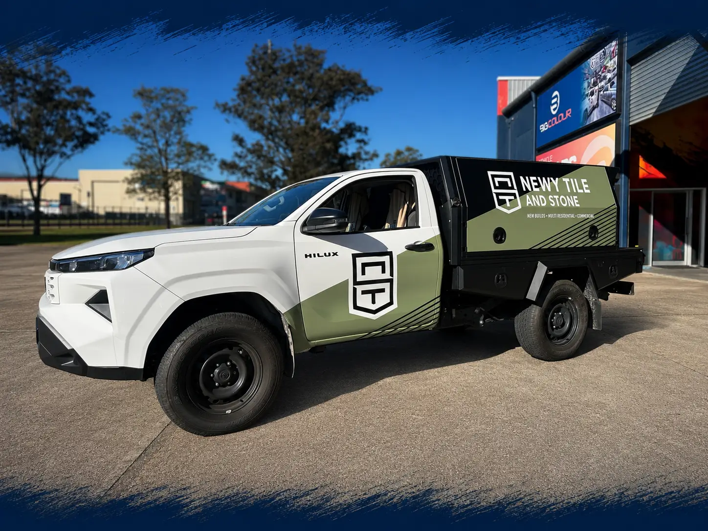 Newt Tile and Stone Hilux ute in a custom green and black wrap by Big Colour