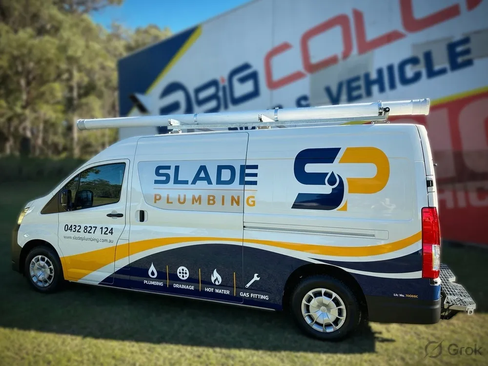 Slade Plumbing service van with blue and yellow branding down the side