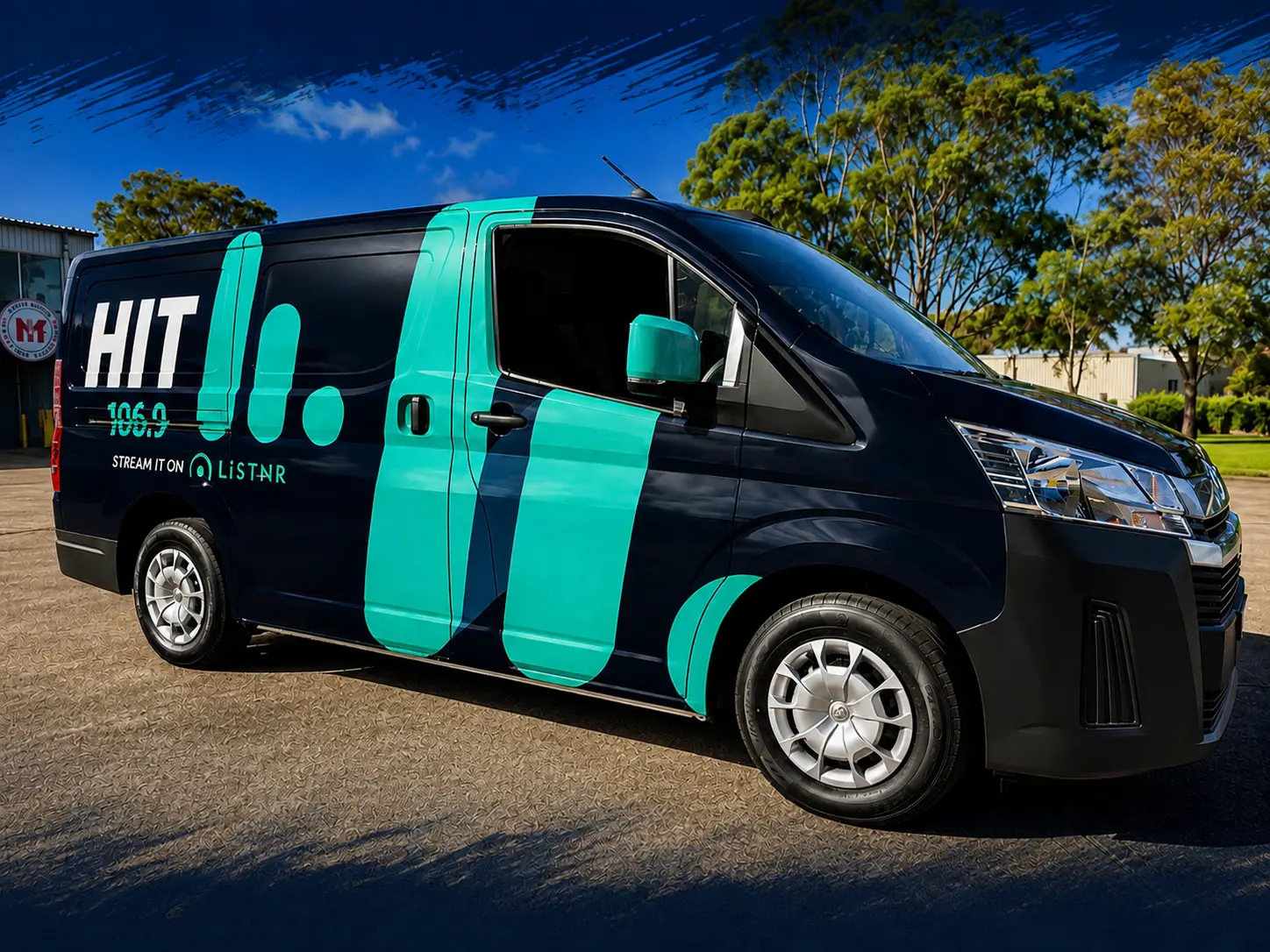 HIT 106.9 FM van in a turquoise and dark blue printed wrap by Big Colour