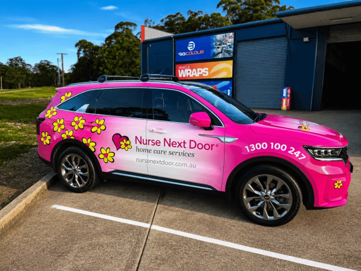 Nurse Next Door pink car wrap with daisy graphics