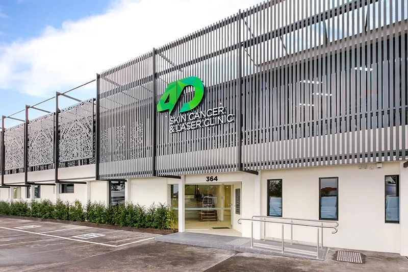 4D Skin Cancer and Laser Clinic sign in green and white on a grey batten facade