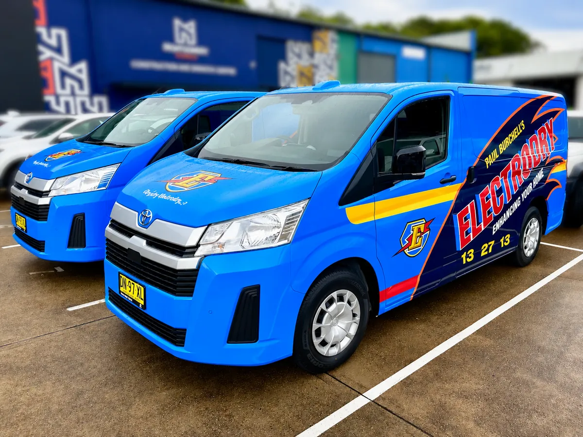 Electrodry Hiace fleet vans lined up at the Big Colour workshop