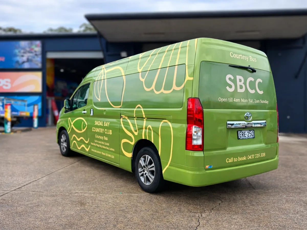 Shoal Bay Country Club courtesy bus in a bright green wrap