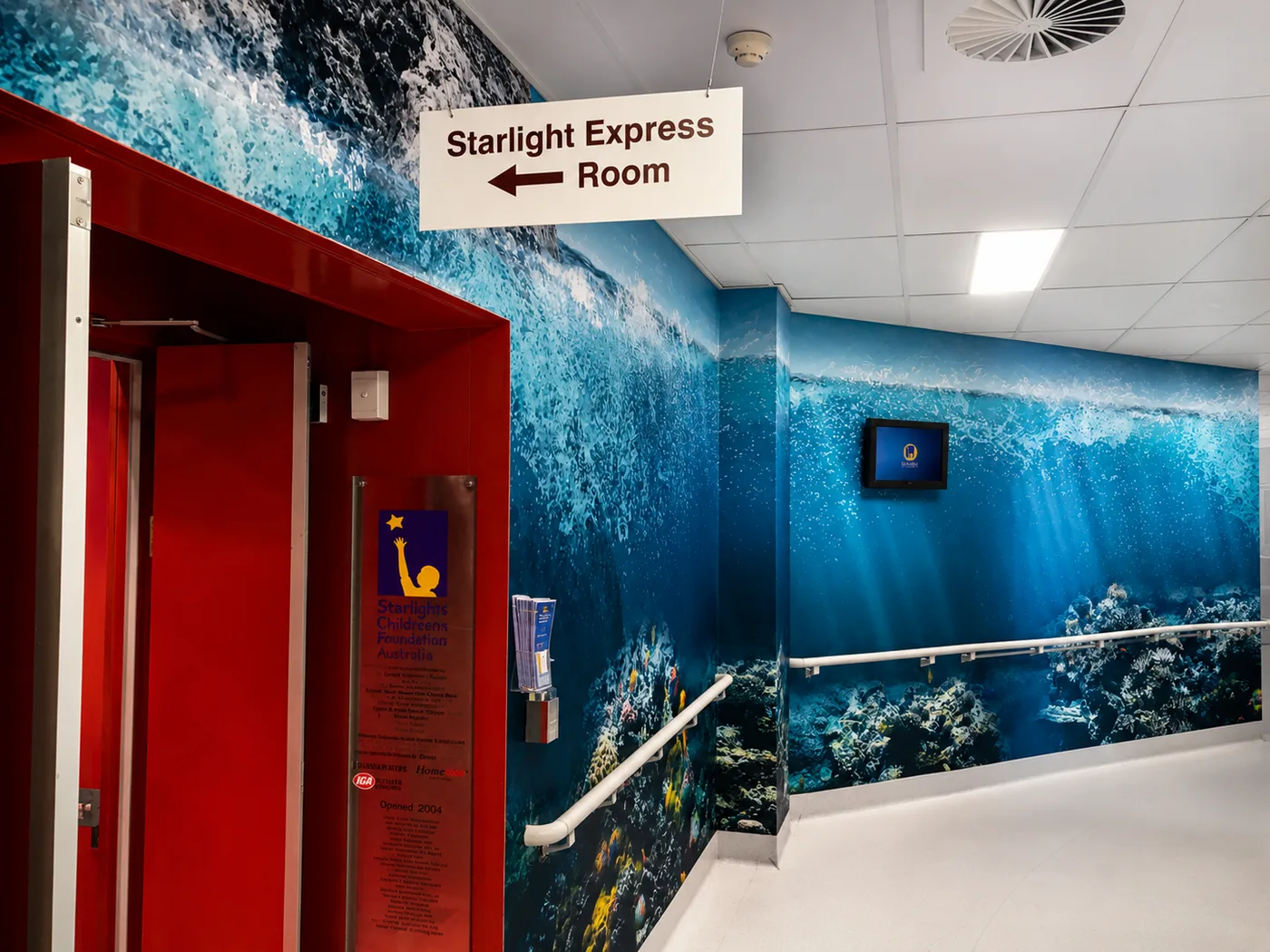 Ocean-themed mural along a hospital corridor, printed and installed by Big Colour
