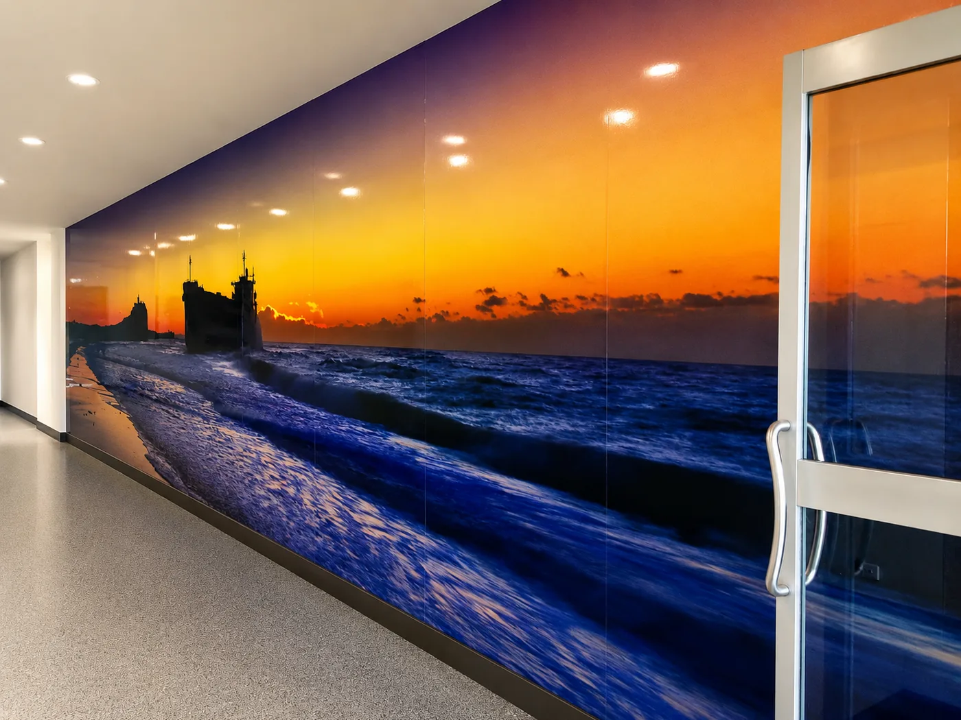 Sunset seascape mural along an office corridor, printed and installed by Big Colour