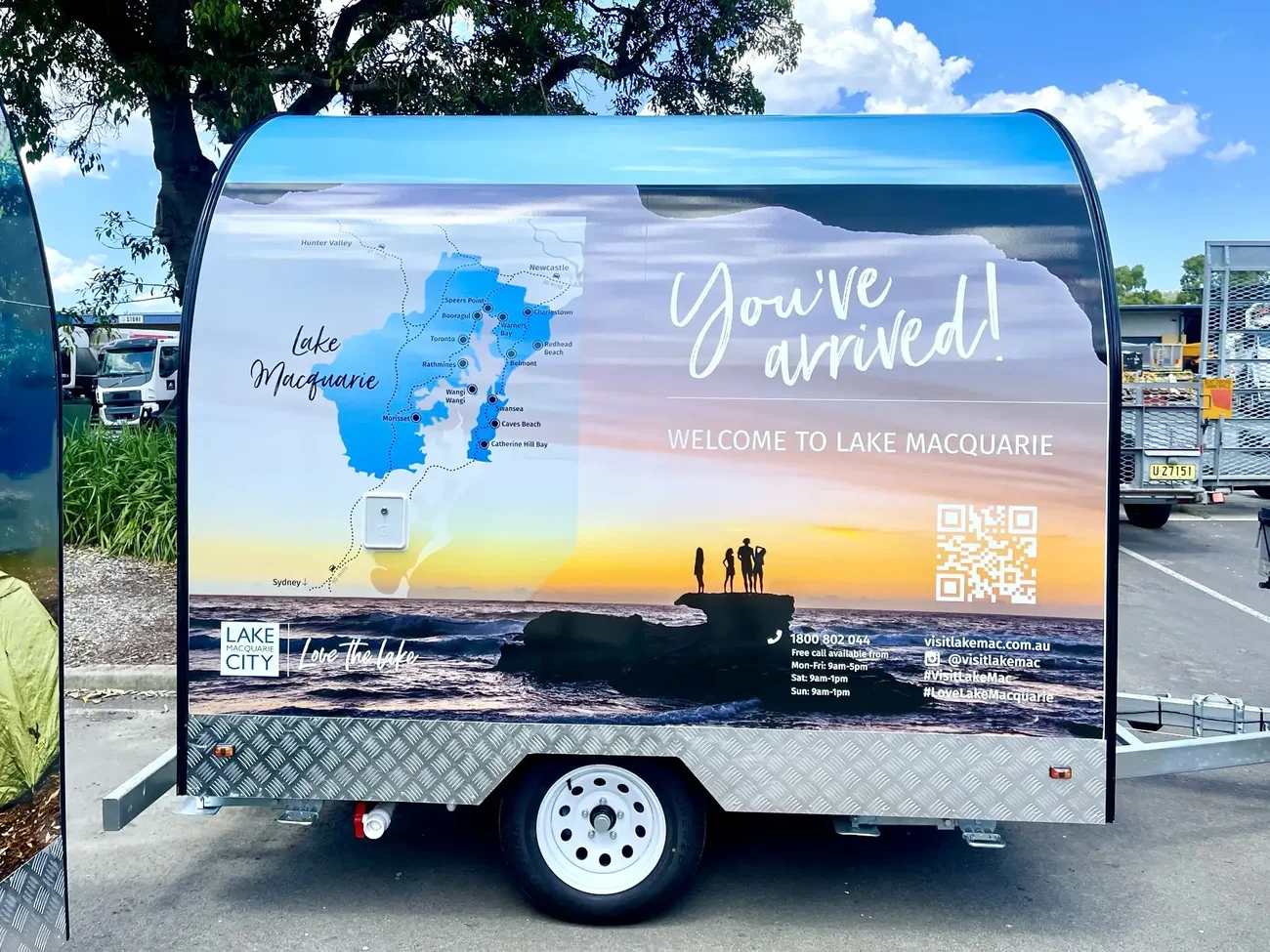 Lake Macquarie City trailer wrapped with a printed sunset beach scene and lake map